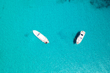 Croatia, Dugi otok. Scenic blue lagoon with anchored yachts, overhead view of sea paradise
