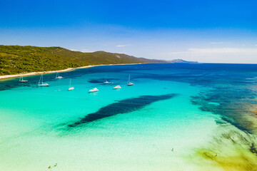 Beautiful Croatia. Aerial view of azure turquoise lagoon on Sakarun beach on Dugi Otok island, Croatia, yachts anchored in clear sea water.
