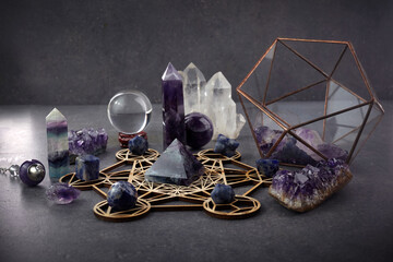 Crystals for healing, fortune telling and astrologhy on dark background. Esoteric and life coaching concept.
