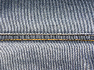 Two thread color chain stitches on blue jeans