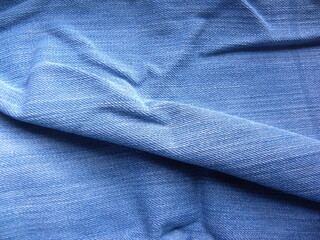 Light blue color jeans with wrinkles background