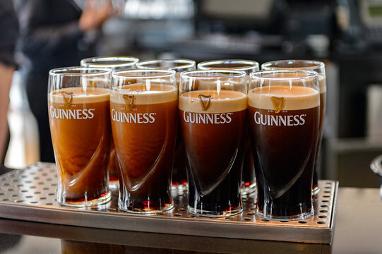 DUBLIN, IRELAND - JULY 12, 2016: Pints of Guinness in the  museum in Dublin. Guinness is an Irish dry stout produced by Diageo originated in the brewery of Arthur Guinness
