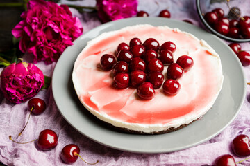 Fresh cheesecake with cherries on the rustic background. Selective focus. Shallow depth of field.
