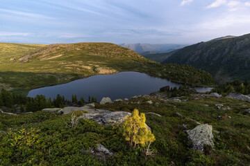 Naklejka premium Lake at Pass Rassokha in Khamar-Daban mountains