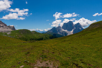 Fototapeta na wymiar view of idyllic mountain scenery in the Alps with fresh green meadows in bloom on a beautiful sunny day in springtime, National Park Dolomite, Italy