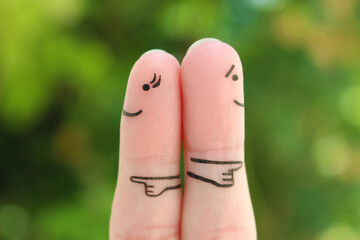 Fingers art of couple. Concept of a couple pointing in different directions.