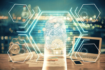 Computer on desktop in office with finger print drawing. Double exposure. Concept of business data security.
