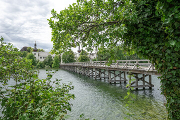 Fototapeta na wymiar Wooden bridge between the castle named Ort and the city Gmunden. Austria