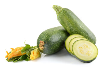 three fresh zucchini with green leaves and flower isolated on a white background