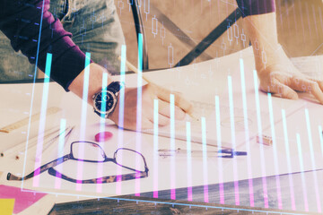 Multi exposure of man standing and planing investment with stock market forex chart.