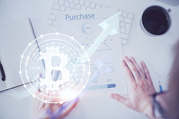 Man's hands working with notes background. Cryptocurrency and finance concept.