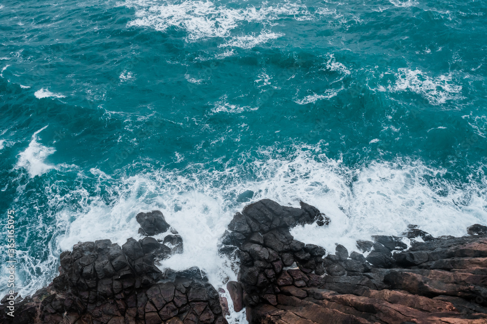 Wall mural wild rocky place. aerial view. sea waves