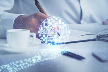 Man's hands working with notes background. Cryptocurrency and finance concept.