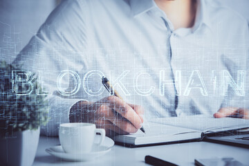 Man's hands working with notes background. Cryptocurrency and finance concept.