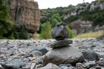 Fototapeta na wymiar Closeup of stone balance in the dry river
