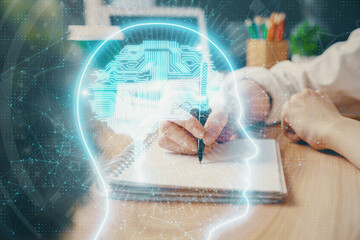 Fototapeta na wymiar Multi exposure of writing hand on background with brain hologram. Concept of learning.
