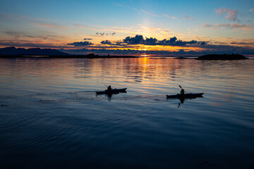 Kayaking in Midnight Sun on Helgeland in Northern Norway