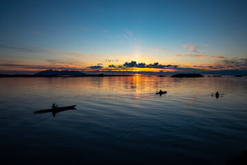 Kayaking in Midnight Sun on Helgeland in Northern Norway