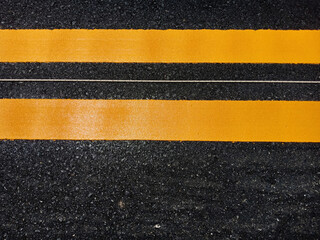 Fototapeta premium Yellow traffic line color For the safety of traveling