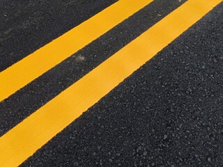 Fototapeta premium Yellow traffic line color For the safety of traveling