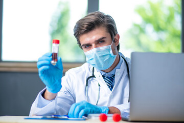 profesional doctor working at his desk collecting data