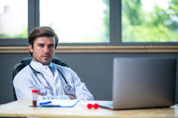 profesional doctor working at his desk collecting data
