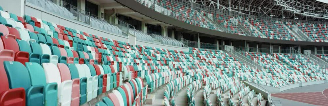 WIDE View of empty stadium seats before game or during Coronavirus COVID-19 pandemic. Shot on RED cinema camera