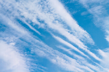 Clouds patterns on bright blue sky , outdoor summer background
