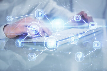 Social network theme hologram with businessman working on computer on background. Multi exposure.
