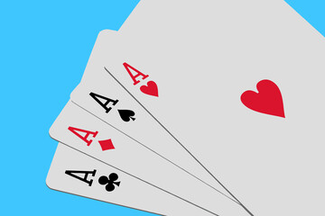 Four aces playing cards on blue background