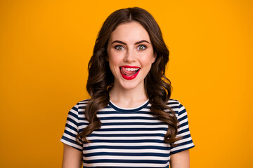 I'm starving Closeup photo of pretty funky wavy lady licking tongue red bright lips perfect toothy smile wear white casual striped t-shirt isolated yellow color background