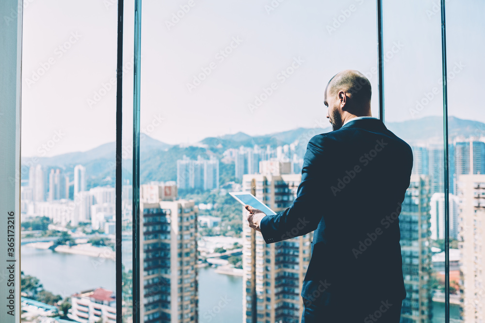 Poster professional trader in formal wear checking bank account in an online database while talking with fi