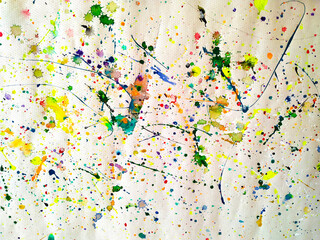 coloured spots of watercolor on a white paper background