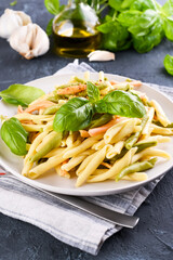 Traditional pasta trofie south of Italy with pesto and basil. Homemade meal for lunch. Healthy, tasty, meat-free food. Italian Cuisine. High quality photo