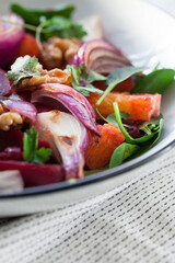 Beetroot, orange, red onion and walnut salad, a vegetarian healthy superfood.