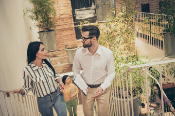 Photo of focused smart confident man woman executive boss marketer expert go upstairs have talk...