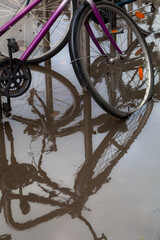 A flood on the street, city bikes in the water. Cracow, Poland, 02.11.2020.