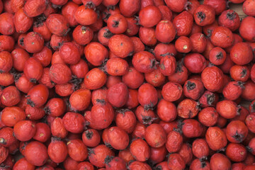 Hawthorn berries on the table, top view, macro.