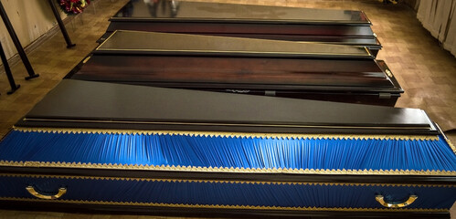 Coffins, funeral home, death of a loved one. Leaving life. Suicide.