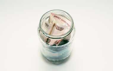 The glass jar is completely clogged with Russian money