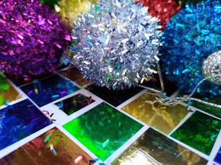 Colorful shiny christmas balls decorations on a colorful background