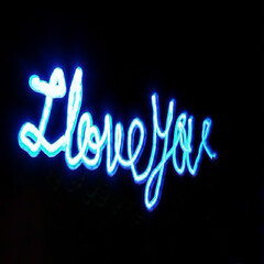 Light painting 3d design. Combination of sky blue and white light against a black background 