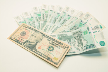 ruble and dollar banknotes lie on a white background