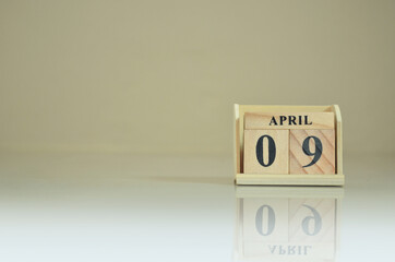 April 9, Number cube with the reflection on the ground.