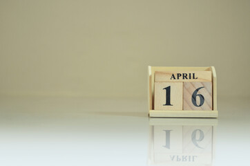 April 16, Number cube with the reflection on the ground.