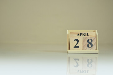 April 28, Number cube with the reflection on the ground.