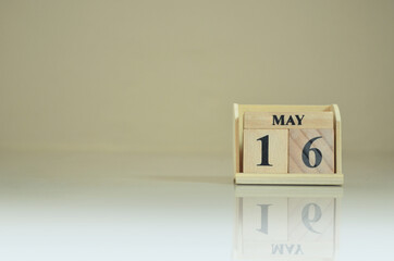 May 16, Number cube with the reflection on the ground.