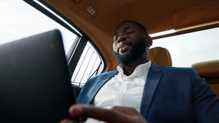 Closeup african man talking video call at car. Man talking to driver at vehicle