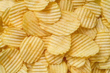 Crispy Potato Chips snack as background texture background. Empty space for text.