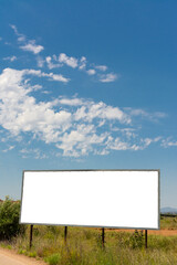 Billboard in the field with blue sky
